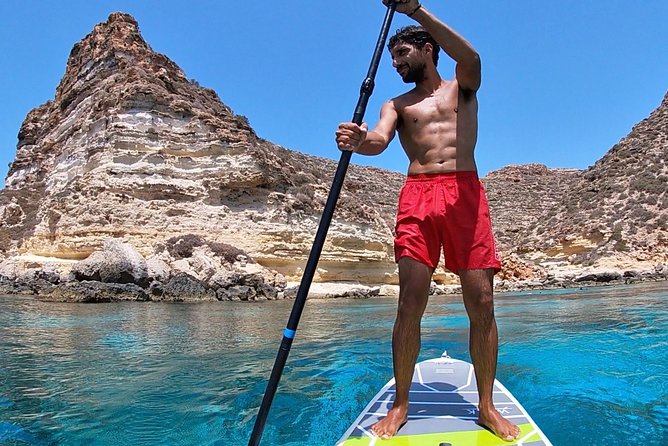 7 hours Boat trip to Lampedusa lunch, SUP and Snorkeling - La Tabaccara cove: where the schedule gives you focused swimming time