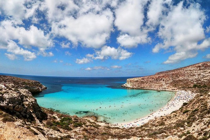 7 hours Boat trip to Lampedusa lunch, SUP and Snorkeling - The Lampedusa migration monument during return: history you see in passing