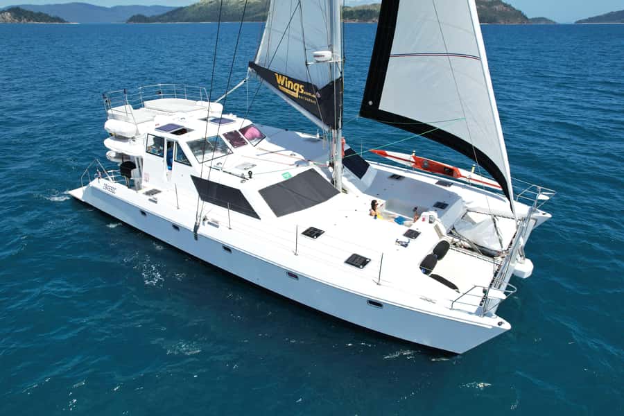 Airlie Beach: Whitsunday Islands Sailing, SUP & Snorkel Tour - Coral Sea Marina Meeting and the Pace of a Calm Group Day