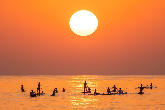 Barcelona: Sunrise Paddle Surf with Instructor and Photos - Who should book this sunrise paddle, and who might pass