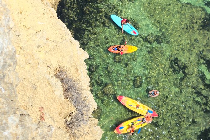 Benagil: Caves, Beaches, and Secret Spots Guided Kayak Tour - Praia da Marinha and the swim stop that makes it feel real