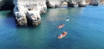 Benagil: Caves, Coves & Secret Beaches Guided Kayaking Tour - Benagil Beach launch: teal water, cliffs overhead, and first strokes