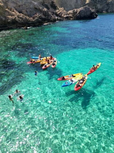 Cala Codolar: Guided Sea Kayaking and Snorkeling Tour - Morning vs Sunset: fruit and cava change the whole mood