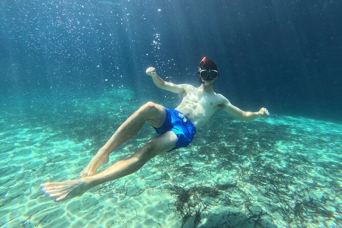 Enchanting Semi Private Kayaking Tours in Milos - Stop 2: Milos paddling through clear water, caves, and coves