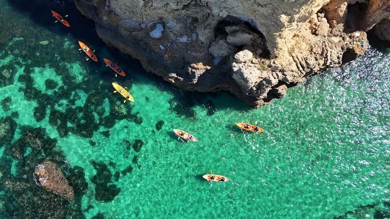 From Lagos: Ponta da Piedade Caves Kayak Tour from Catamaran - Guided kayaking through caves and natural arches (about 1.15 hours)