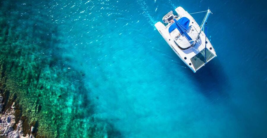 From Ornos: Mykonos Delos Catamaran Cruise with Meal & SUP - Getting Set Up on the Catamaran Without Overthinking It
