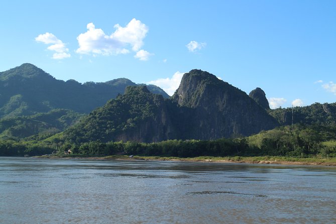 FULL DAY – Kuang Si Waterfall, Kayak on the Nam Ou / Mekong River, Pak Ou Caves - Whisky Village stop: short cultural pause between big nature hits