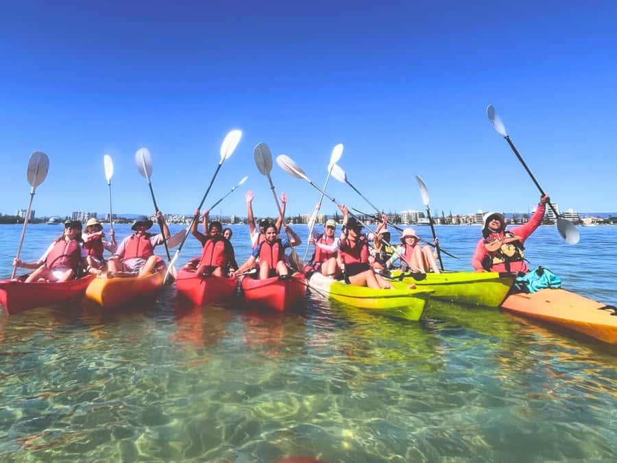 Gold Coast: Wave Break Island Kayaking & Snorkeling tour - Landing at Wave Break Island: walking off the kayak with a story in your ears