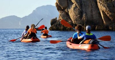 Golfo Aranci: Kayak Tour with Dolphins and Aperitif - From Spiaggia dei Baracconi to Cala Moresca: your first stretch on the water