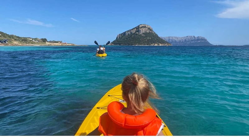 Golfo Aranci:Small group, german guided Kayak tour&Dolphins - Cala Moresca swim and snorkel: where the water quality pays off