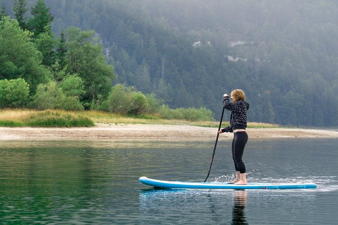Half Day Stand-up Paddle Boarding (SUP) trip on Lake Predil - Paddling the lake: beaches, freshwater springs, and mountain views