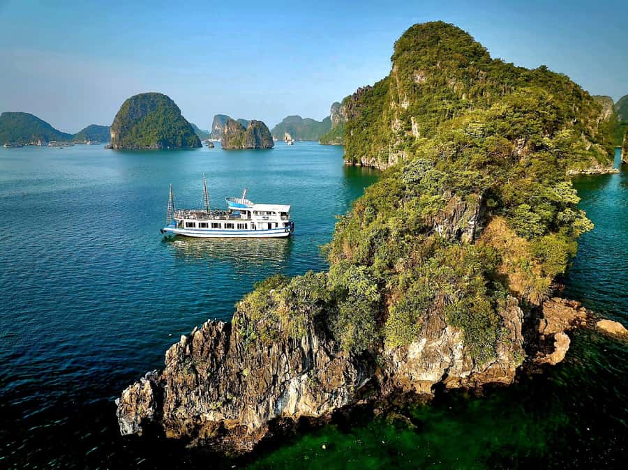 Halong Bay: Day Cruise with Caves, Kayaking & Sunset Party - Luon Cave Lagoon: Kayak or Bamboo Boat for Real Water Time
