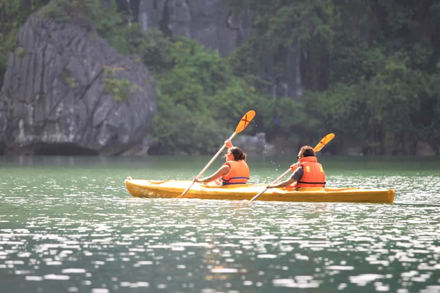 Halong Bay: Day Cruise with Caves, Kayaking & Sunset Party - Titop Island: Swim, Hike, or Take It Easy With Great Bay Views