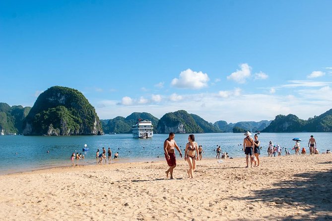 Halong Bay Day Tour With Titop Island, Cave, Kayak & Lunch - Sunset party on deck: snacks, fruit, and a quieter stretch
