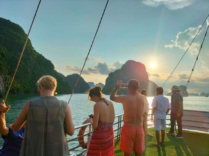 Hanoi: Full-Day Halong Bay Cruise with Swimming & Kayak Tour - Sunset Party Onboard: Red Wine, Cookies, Fruit, and Easy Food