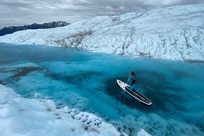 Helicopter and Glacier Paddle Boarding -PRIVATE - Dry suit, PFD, and micro-spikes: the safety setup that makes paddleboarding possible