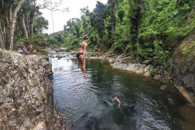 Hike El Yunque Rainforest and Kayak Bio Bay Combo Tour - Entering El Yunque: river-wading trails, bamboo, and waterfall pools