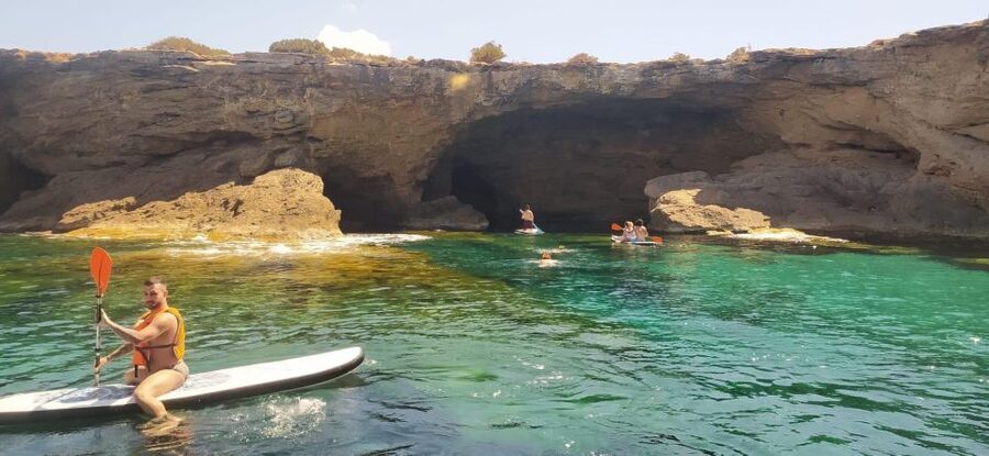Ibiza: Sea Caves & Coves Snorkeling Paddle Boarding Tour - Drinks, music, and the deck experience between swim stops