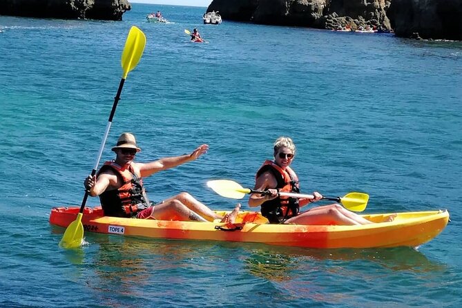 Kayak Adventure through the Ponta da Piedade Caves in Lagos - Swim break, drink time, and sunbath—how the ending works