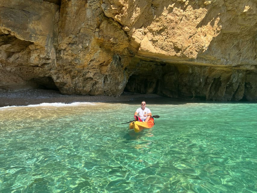 kayak route in granadella javea cave llop marí,cala en caló - Cala en Caló: guided time, a photo stop, and sea life on the surface