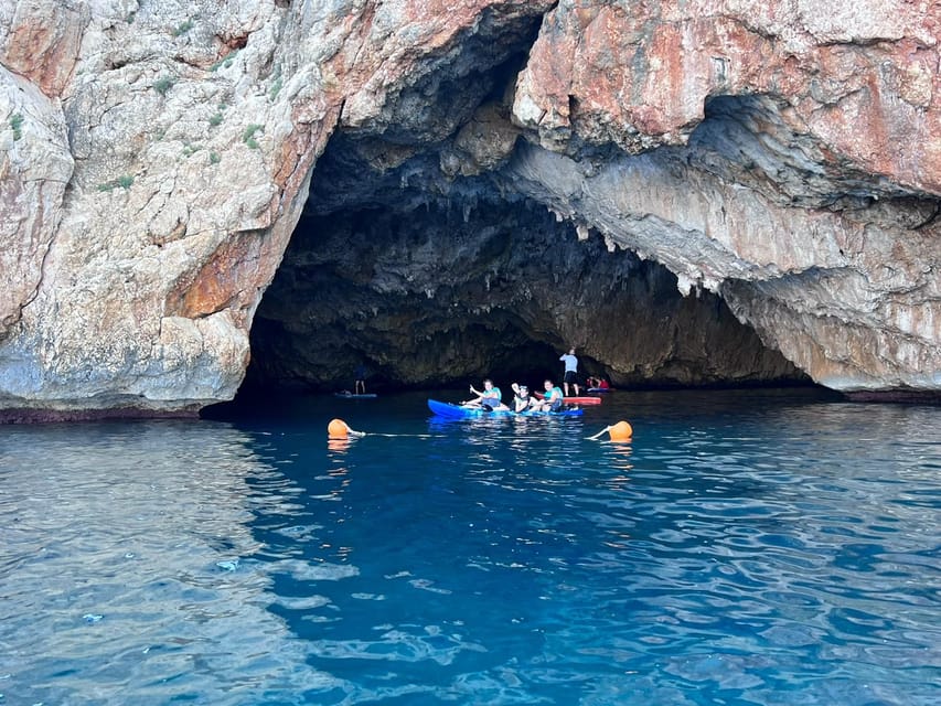 kayak route in granadella javea cave llop marí,cala en caló - Guides in action: communication, pacing, and named pros