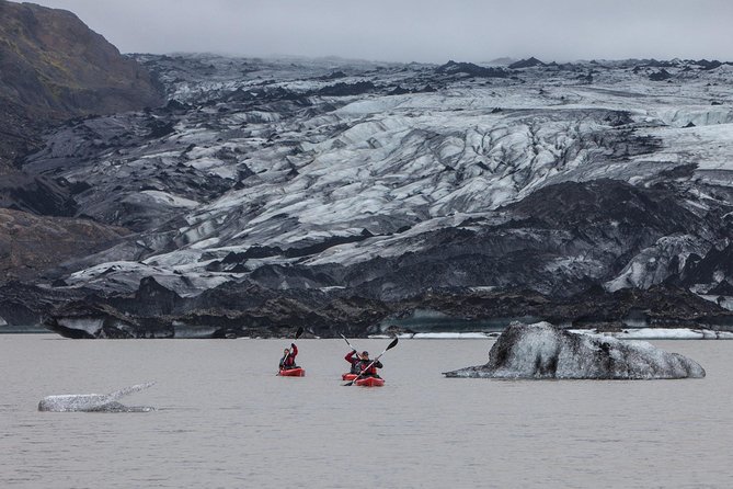 Kayaking on the Sólheimajökull Glacier Lagoon - Paddling the glacier lagoon: calm water, blue ice, and quiet moments