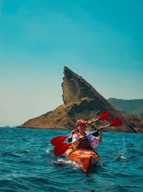La Ciotat: Calanques National Park Guided Kayak Tour - Calanque du Mugel: caves, cliff views, and a quick reset