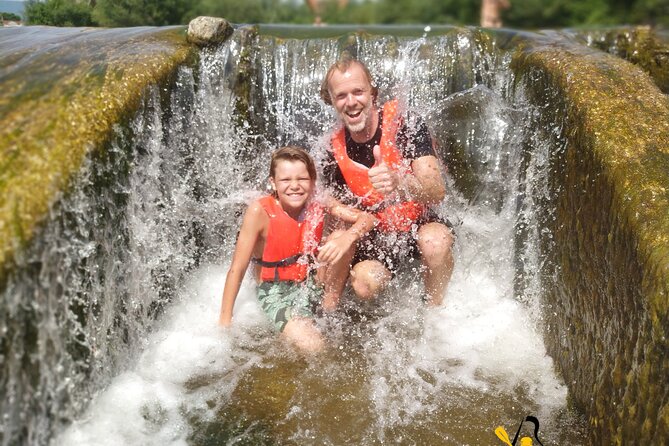 Lucca: kayak tour with aperitif - Swim break and slides: when the fun gets physical (in a good way)