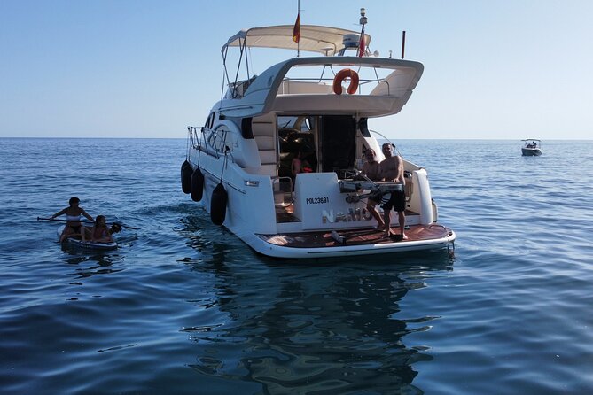 Luxury Yatch trips + Open Bar + Tapas + Paddle Surf + Snorkel - Paddle Surf on the Yacht Trip: Fun, but Check the Board
