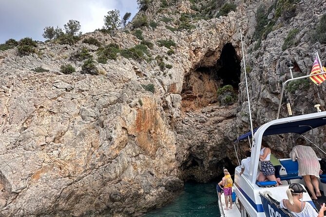 Mallorca Beach & Caves 4hr Boat Trip Drinks, Tapas, SUP & Snorkel - Cruising past caves and catching Cap de Formentor from the water