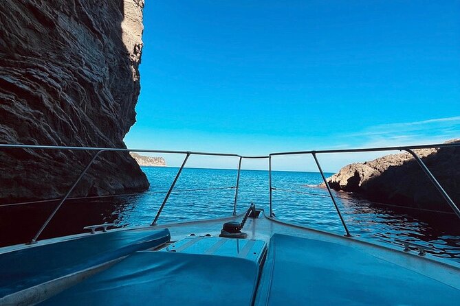 Mallorca Beach & Caves 4hr Boat Trip Drinks, Tapas, SUP & Snorkel - Alcanada Lighthouse stop: snacks, drinks, and a relaxed final swim