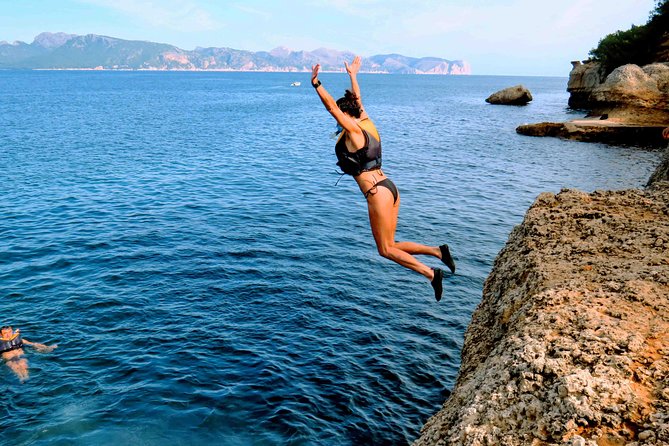 Mallorca: Kayaking, Sea Cave, Cliff Jumping & Snorkel Tour - Snorkeling for treasure: clear water, a guided search, and a safety setup