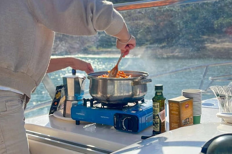 Mallorca: Private Watersports Boat. LUNCH Drinks SUP, Tubing - Punta Negra and the Palmanova/Magaluf Zone: Built for Photos and the Donut Ride