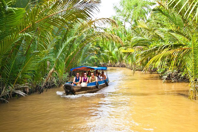 Mekong Delta Tour with Cooking and Kayaking - Town walk, motorized boat, and sampan canals
