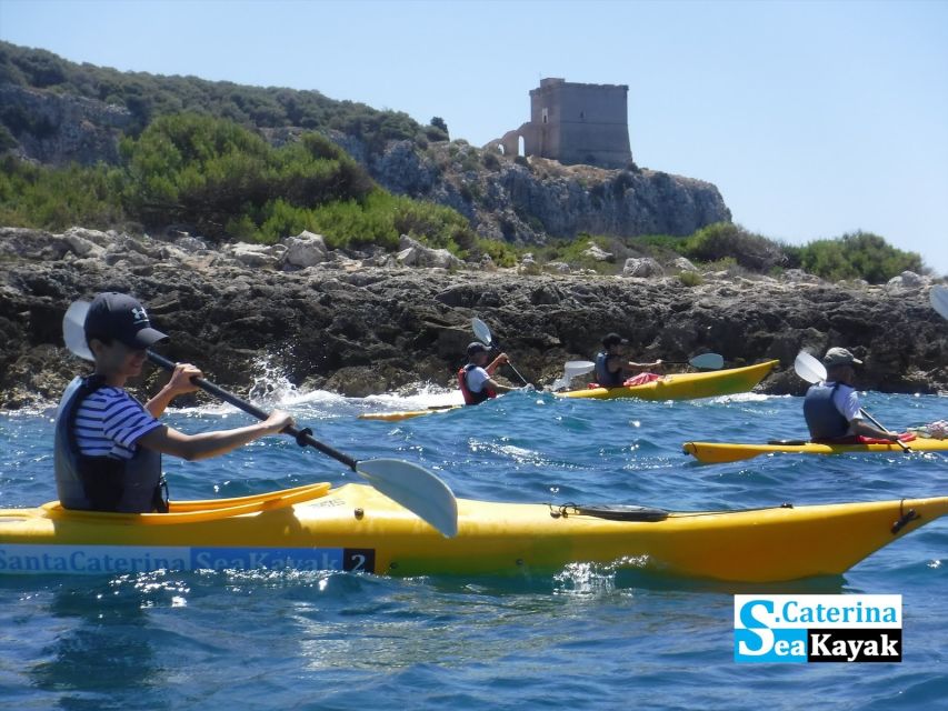 Porto Selvaggio kayak tour + cliff diving + cold springs - Kayaking under S. Maria dell’Alto Tower: the best kind of coastline magic