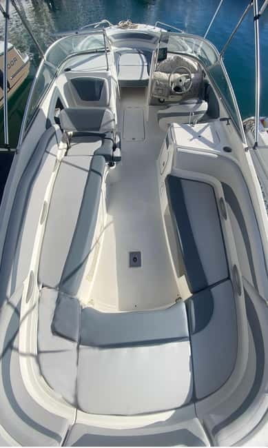 Puerto Banús: Floky Boat Cruise with Snorkeling & Paddle SUP - The Floky boat setup: shade, swim platform, and deck comfort
