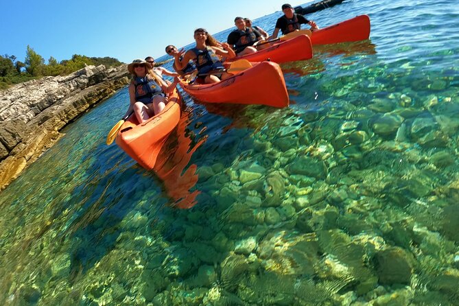 Pula Kayak Tour-Cliff jumping,snorkeling& free GoPro pictures - Learning how to kayak in a sea-canyon setting