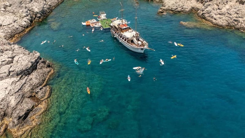 Rhodes: Gulet Trip with Food, Drinks, SUP, Kayak & Swimming - Greek Lunch and Unlimited Drinks: What You Get, What Costs Extra