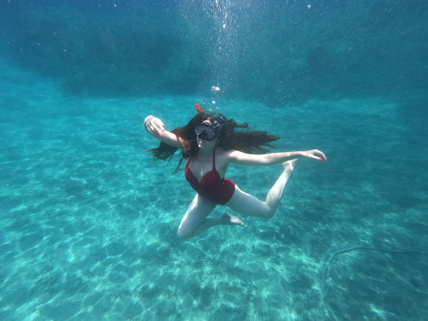 Santorini: Sea Caves Kayak Trip with Snorkeling and Picnic - Entering the Caves: Blue Water Looks Different Up Close