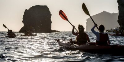 Santorini: Sunset Sea Kayak with Light Dinner - The paddle east: White Beach cliffs, then Red Beach volcanic color