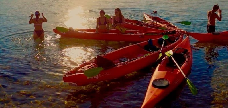 Sardinia: Sunset Kayak Tour + Snorkeling and Local Aperitif - Entering the sea cave and snorkeling in crystal-clear water