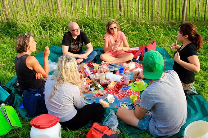 Small-Group Guided Sunset Canoe Tour in Waterland with Dinner - Majel’s Village Welcome Makes the Wetlands Story Click