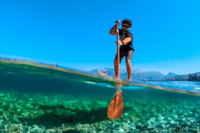 Small group paddle boarding tour to Bagni Regina Giovanna - From Marina Grande to Punta del Capo: the coastline perspective that sells the tour