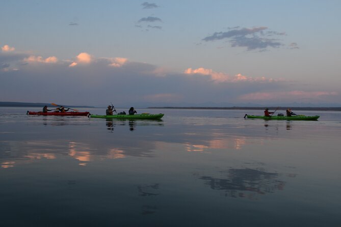 Small-Group Sunset Kayaking Tour on Lake Yellowstone - Wildlife, geysers, and the sunset timing around Absaroka Mountains