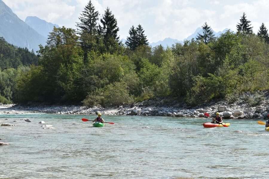 Soča: Kayaking on the Soča River Experience with Photos - Swimming, jumping, and the fun stops in emerald pools