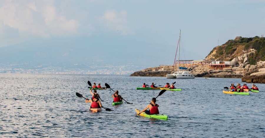 Sorrento: Premium Kayaking Experience with Swimming - The swim break: turquoise water and rocky-foot reality