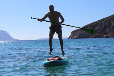 Stand Up Paddle With Dolphins, aperitif and pictures - Cala Moresca: where you relax, swim, and spot more wildlife