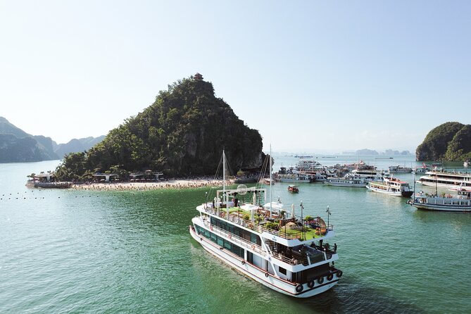 Sweetness Cruise Ha Long Bay: Caves, Kayaking, Swimming & Lunch - Sunset Party: Fresh Fruit, Deck Music, Jacuzzi Downtime, and Flag Photos