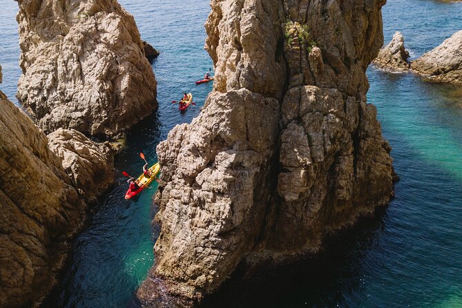 Tossa de Mar: Kayak & Snorkel Tour with Paella from Barcelona - Villa Vella, fortress walls, and the lighthouse view you’ll want photos for