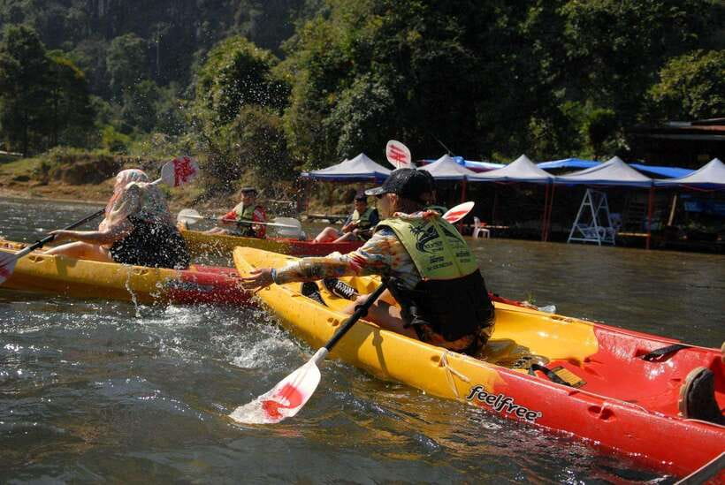 Vang Vieng: Day Tour with Kayaking, Ziplining, and Rafting - Tham Chang Underwater Cave Tubing on a Tire: The Main Moment